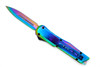 Side view of Nebula Strike OTF showing rainbow titanium blade with blood groove
