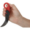 CRKT Provoke fully deployed in hand demonstrating ergonomic grip and ring design.