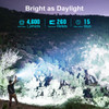 Brightness demonstration showing 4,600-lumen beam illuminating a mountainside.