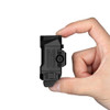 PL X compact weapon light size reference shown between fingers demonstrating low-profile design
