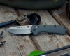 Buck 0791GYS laid flat showing full profile of gray aluminum handle and drop point blade