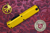 Handle detail showing Cerakote yellow finish and black thumb slide