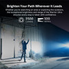 Olight Warrior Ultra beam illuminating building at night demonstrating distance