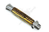 Close-up of faux stag handle with push button and safety switch on Italian style switchblade.