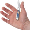 Knife held in hand showing compact size and everyday carry scale