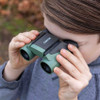 Child using Carson Wildcat 7x18 binoculars outdoors bird watching kids binoculars