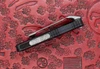 Microtech Exocet II side profile showing compact OTF frame, switch, and pocket clip depth