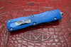 Closed Marfione Custom Dirac OTF showing front actuator and blue titanium hardware