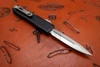 Side angle of Microtech UTX-70 open showing stonewash M390MK blade and pocket clip