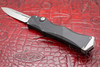 Front angle of open Halo IV single action OTF knife with black anodized handle