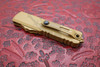 Microtech UTX-85 handle detail showing firing switch and contour
