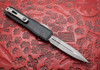 Microtech UTX-70 reverse side with titanium pocket clip and glass breaker