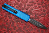 Rear side view of the Microtech UTX-85 GEN IV showing the black pocket clip and black double edge blade.