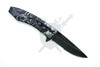 Open Wolf Moon assisted pocket knife with half serrated black stonewashed blade and embossed wolf scene handle