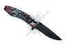 Rear angled view of Red Wolf Moon spring assisted folding knife with pocket clip and embossed wolf artwork