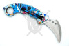 Backside view of Galactic Mischief assisted karambit knife with pocket clip and colorful artwork handle