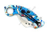 Folded Galactic Mischief karambit pocket knife with pocket clip and colorful alien artwork print handle