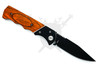 Angled front view of automatic folding knife with black-coated blade and wood handle.