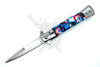 Open Chucky artwork folding knife with stainless bayonet-style blade.