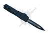 Rear angled view of the Microtech UTX-70 Tactical showing black titanium pocket clip and black dagger blade
