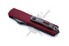 Backside view of Microtech UTX-70 Gen IV Merlot OTF knife showing titanium pocket clip and glass breaker