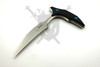 Reverse side of the Microtech Bee featuring Bastinelli signature and carbon fiber scales