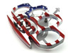 Angled close-up of the patriotic red, white, and blue metal paperweight showing raised USA lettering