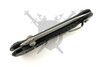 Spine profile of the Microtech LUDT RAM-LOK manual folder showing its slim design, bearing pivot system, and precision-machined frame.