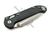 Closed Microtech LUDT RAM-LOK showing the black Frag-pattern G-10 scales, RAM-LOK mechanism, and compact everyday carry profile.