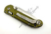 Rear angled view of the Microtech LUDT RAM-LOK highlighting the reversible stainless steel pocket clip, precision hardware, and OD Green aluminum frame.