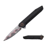 MTech USA MT-A2031BK spring assisted folding knife with etched drop point blade, black anodized aluminum handle, and red accent near the pivot.