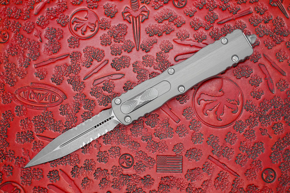 Microtech Dirac Delta OTF Knife – Apocalyptic Serrated Dagger Blade, Natural Clear Aluminum Handle