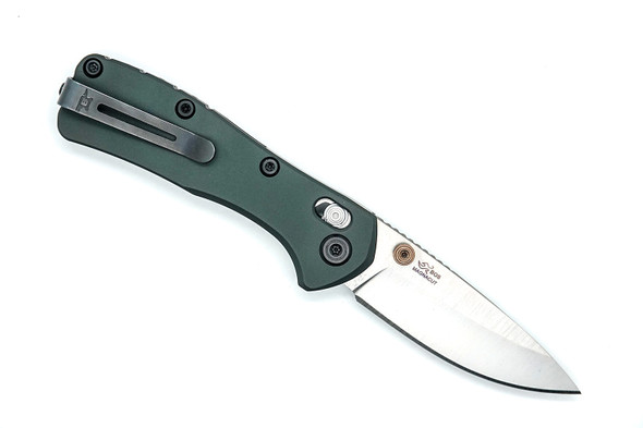 Buck 0790GRS Mini Range Elite Folding Knife reverse side showing green handle, deep-carry clip, and BOS MagnaCut stamp.