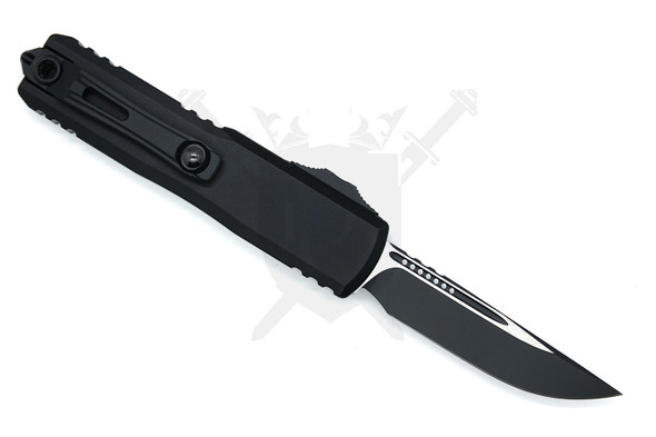 Reverse side view of the Microtech UTX-85 showing the black machined aluminum handle and blade profile.