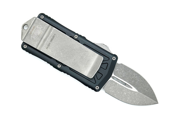 Microtech Exocet OTF knife closed displaying integrated stainless steel money clip