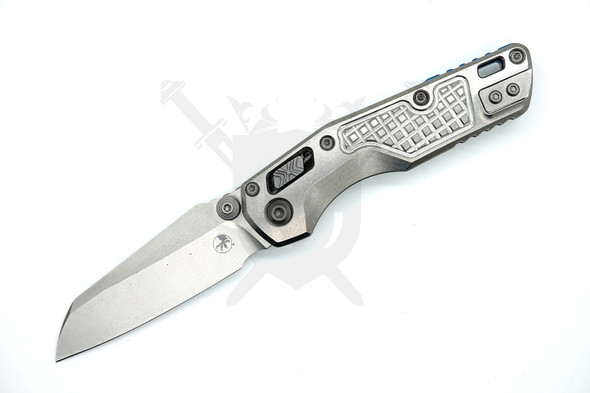 Close-up of frag-pattern stonewashed titanium handle on Microtech MSI Marfione Select