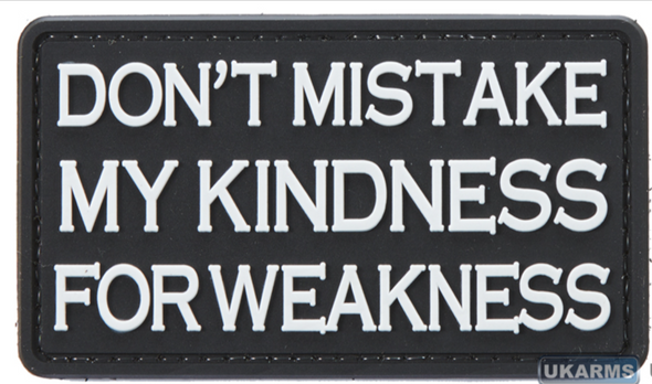 Black PVC morale patch with raised white text reading "Don't Mistake My Kindness for Weakness" and hook backing for Velcro attachment.
