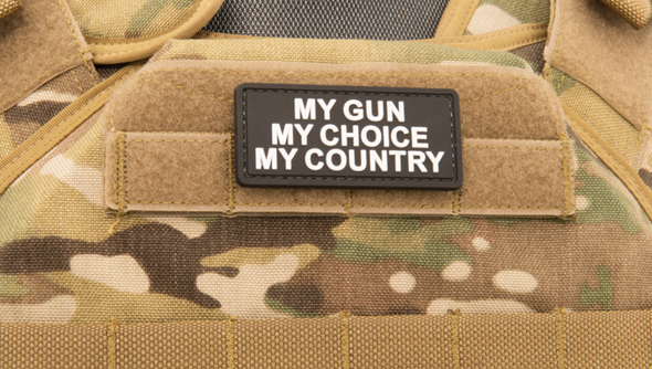 Black PVC morale patch with white text reading “My Gun, My Choice, My Country” mounted on a tactical vest with hook-and-loop backing.