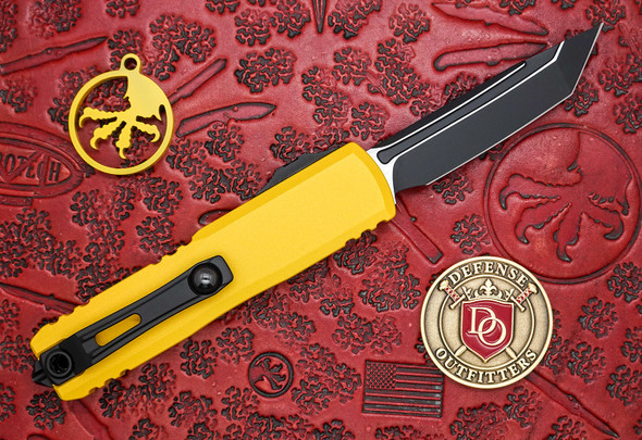 Close-up of Microtech UTX-85 tanto blade with black tactical finish and fuller detail