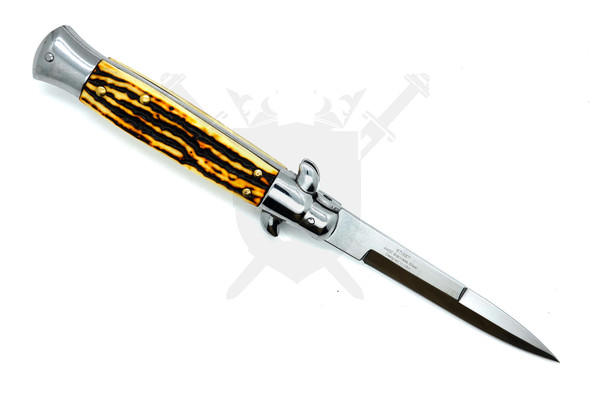 Angled view showing reflective bayonet blade and classic stiletto handle design.