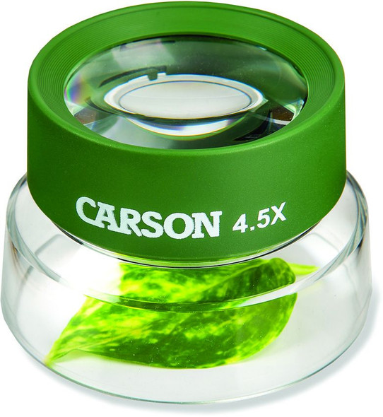 Carson BugLoupe magnifier placed over green leaf showing enlarged detail through lens