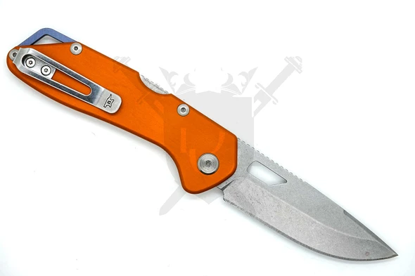 Buck 724 Mustang open knife showing stainless pocket clip and orange anodized handle