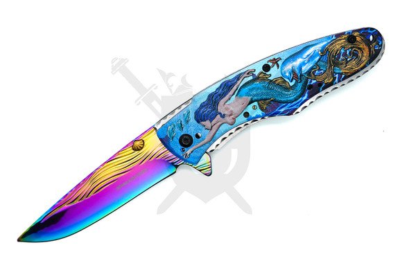 Close-up of embossed mermaid handle artwork with colorful titanium-coated blade