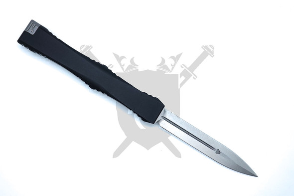 Reverse side view of Microtech Nemesis IV showing stonewashed dagger blade and black aluminum handle