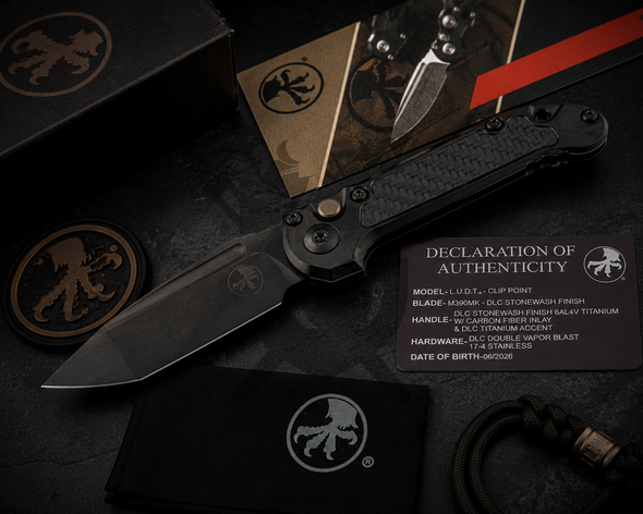 Microtech Marfione Select LUDT Gen III automatic knife with M390 tanto DLC stonewashed blade, titanium carbon fiber handle, presentation box, certificate of authenticity, and Microtech accessories.