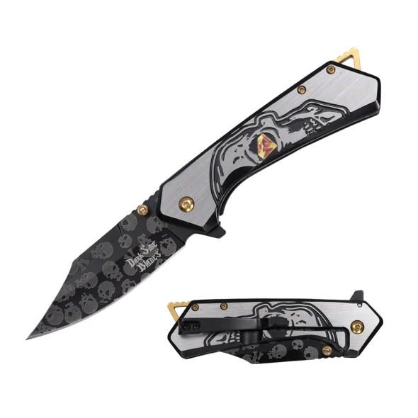 Dark Side Blades Gold spring assisted knife featuring a black clip point blade with embossed skull graphics and a stainless steel handle engraved with a hooded skull design.