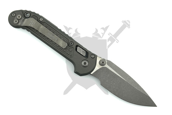 Microtech 1135RL-10APFRNC LUDT RAM-LOK manual knife open with Apocalyptic M390MK drop point blade and Natural Clear Frag aluminum handle.