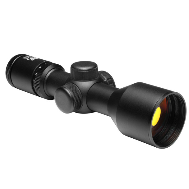 Front angled view of the NcSTAR Compact 3-9x42 scope with matte black finish and ruby-coated objective lens.