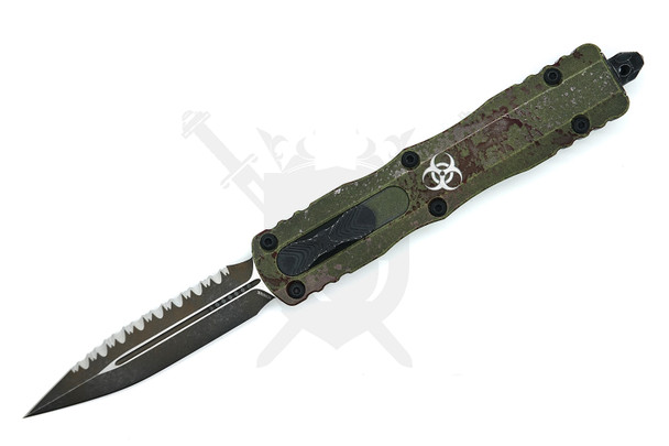 Microtech Dirac Delta 227-3OBDS open – full-serrated double-edge blade with Outbreak Deep Engraved handle and biohazard emblem.