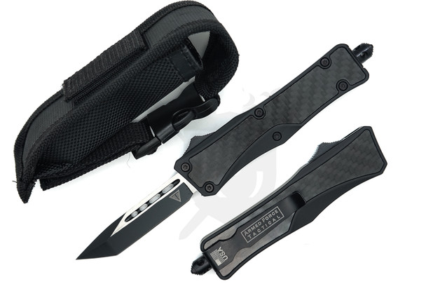 Stealth Vector carbon fiber OTF knife with two-tone American Tanto blade displayed next to black nylon sheath.